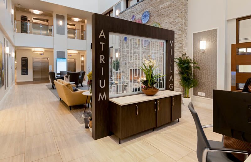 Still photo of Atrium Village indoor entrance showcasing modern furniture and design